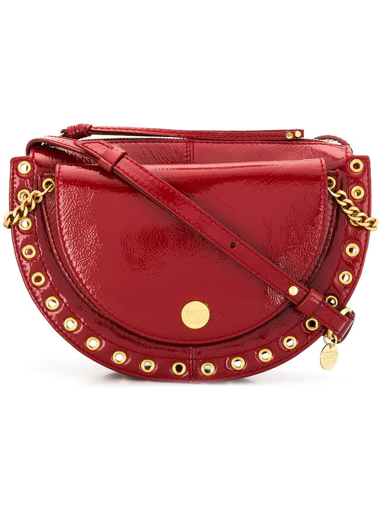 grommet-embellished shoulder bag