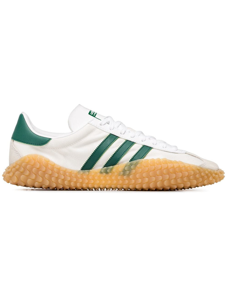 white and green X country kamanda sneakers